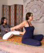 Aiyana Fraley giving a Thai massage session on client.
